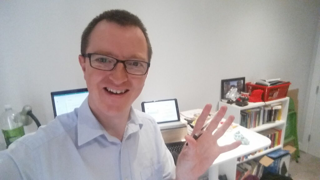 John at his desk